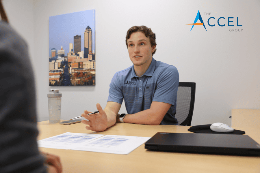 A photo of employee benefits sales executive, Joe Krueger, talking with a client